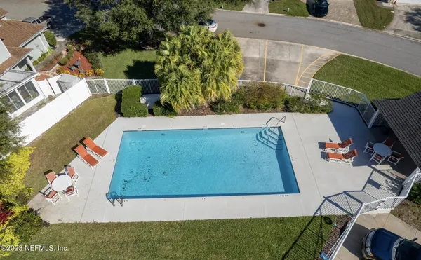 a view of a garden with large trees