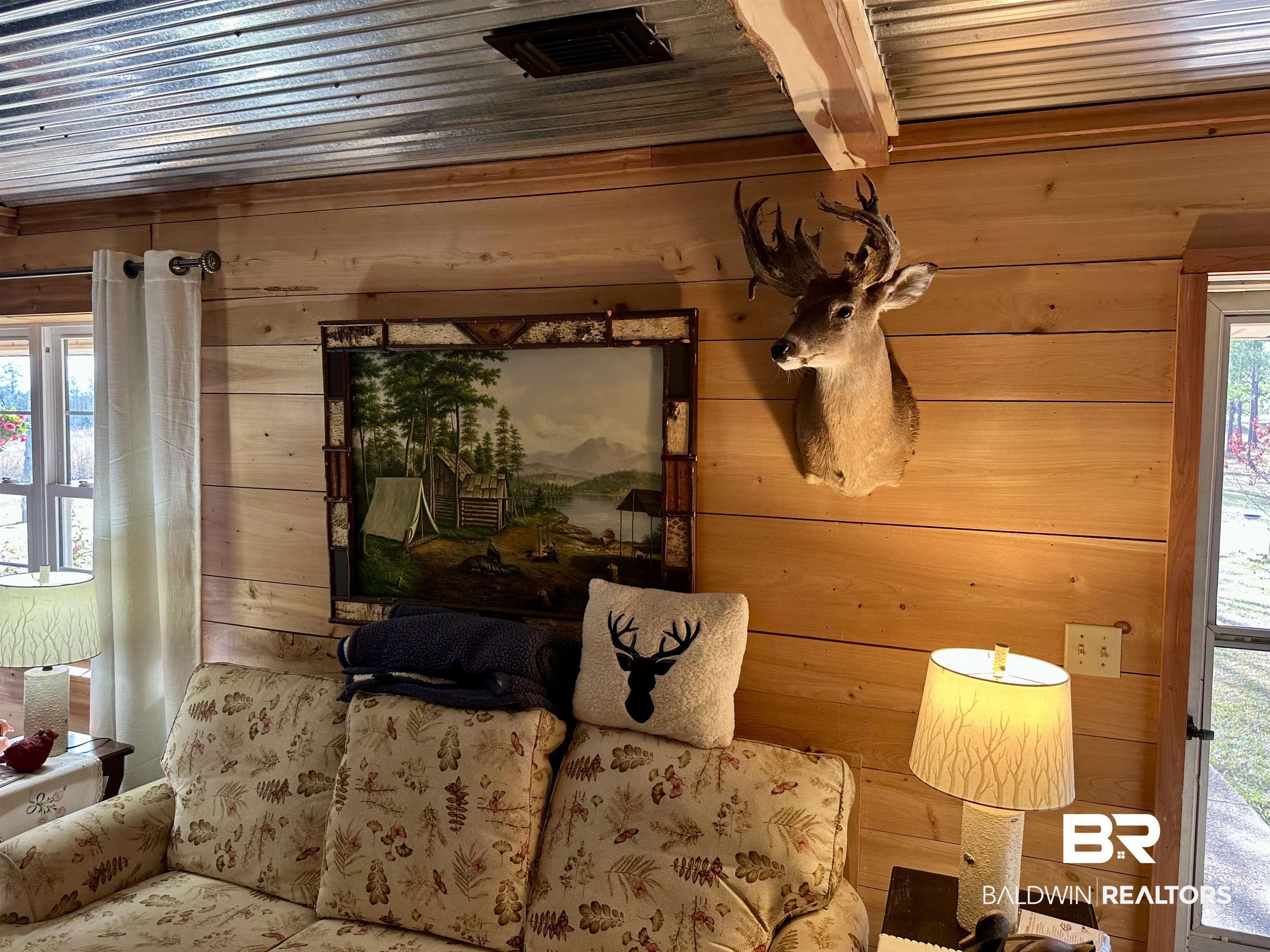 2772 Ramah Road Evergreen, AL 36401 - Photo 3 of 12 Interior space featuring wooden walls and visible vents