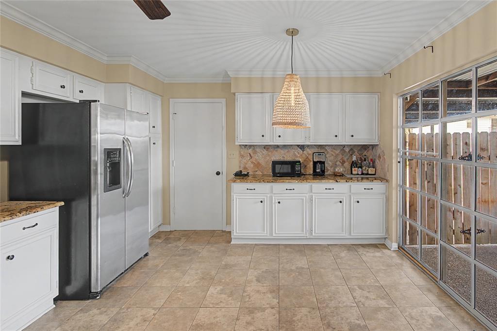 10056 Alondra Street Shreveport, LA 71115 - Photo 11 of 31 a kitchen with stainless steel appliances a refrigerator sink and cabinets