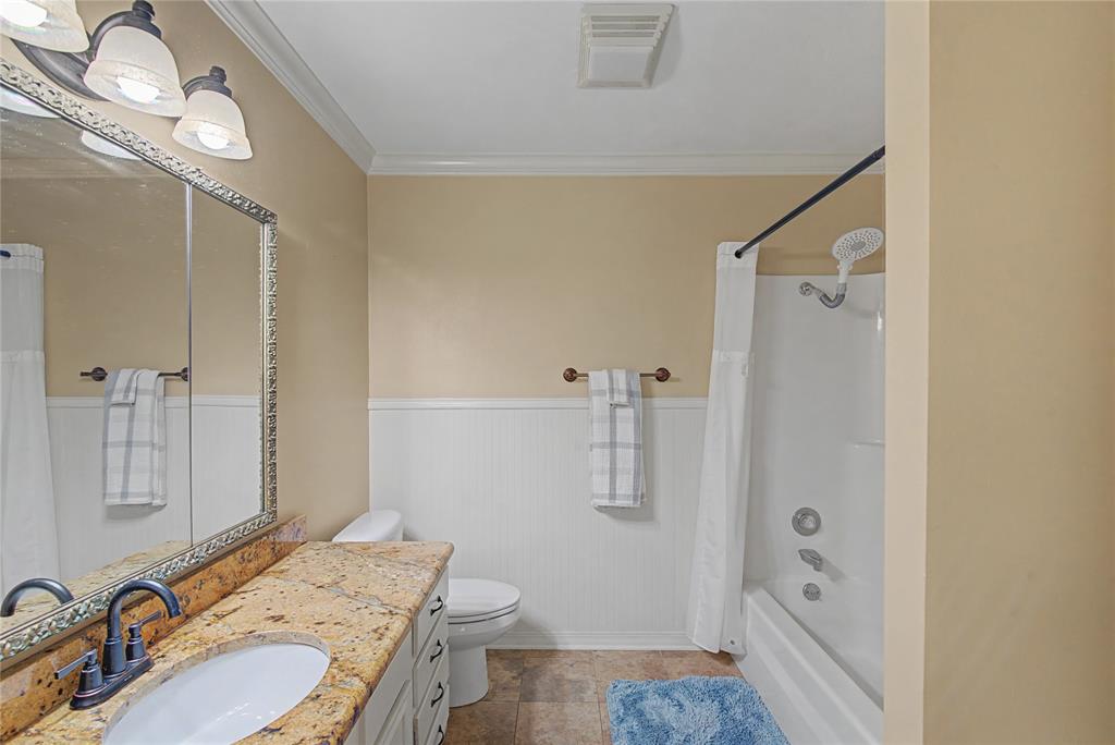 10056 Alondra Street Shreveport, LA 71115 - Photo 17 of 31 a bathroom with a granite countertop sink toilet and shower