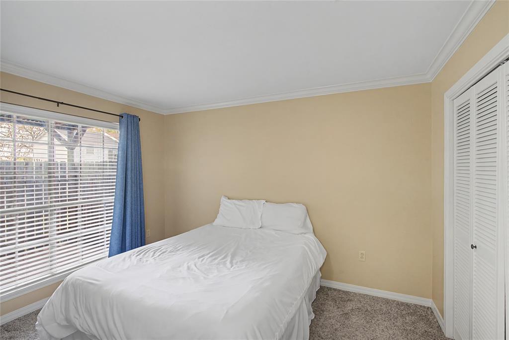 10056 Alondra Street Shreveport, LA 71115 - Photo 18 of 31 a bedroom with a bed and a window