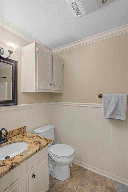 10056 Alondra Street Shreveport, LA 71115 - Photo 23 of 31 a bathroom with a granite countertop toilet sink and mirror