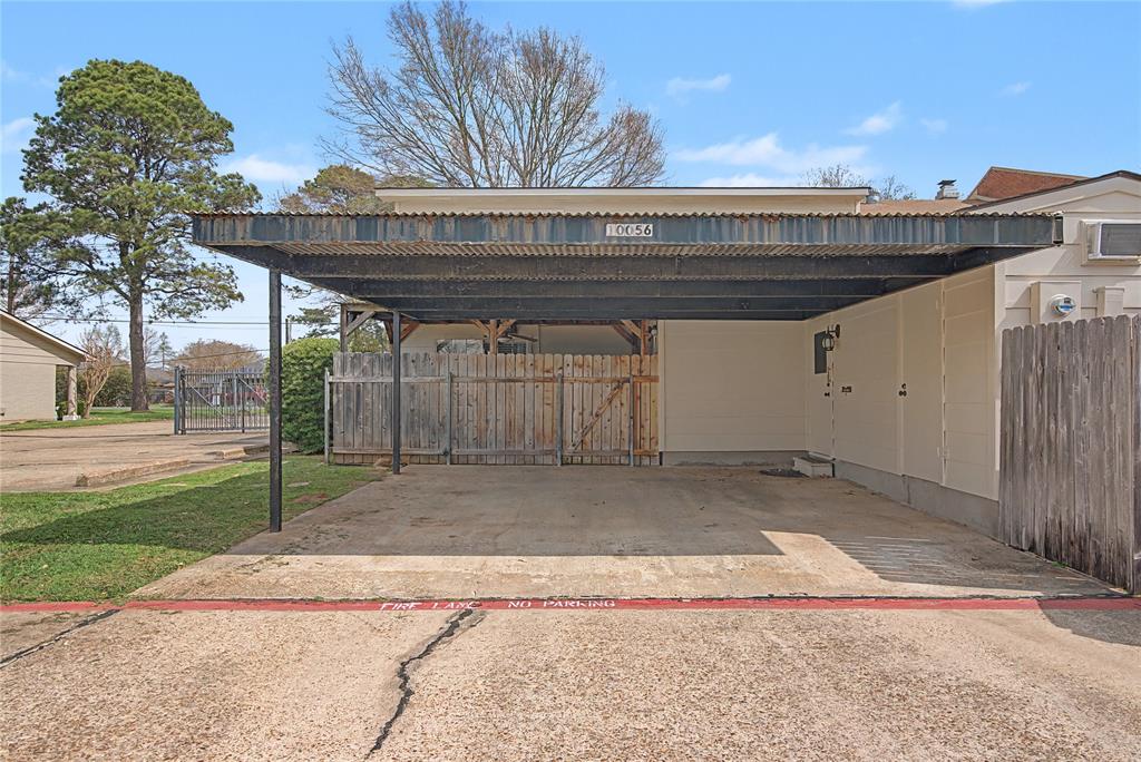 10056 Alondra Street Shreveport, LA 71115 - Photo 30 of 31 a view of backyard with barbeque grill and wooden fence