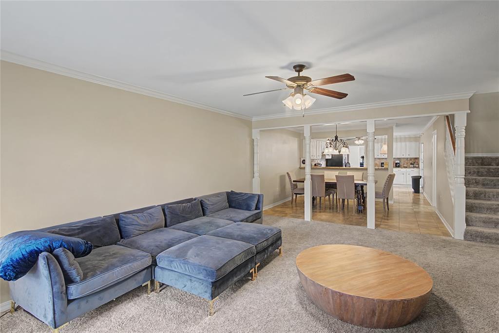 10056 Alondra Street Shreveport, LA 71115 - Photo 5 of 31 a living room with furniture a table and chairs