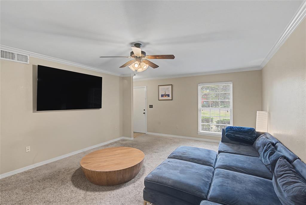 10056 Alondra Street Shreveport, LA 71115 - Photo 6 of 31 a living room with furniture and a flat screen tv