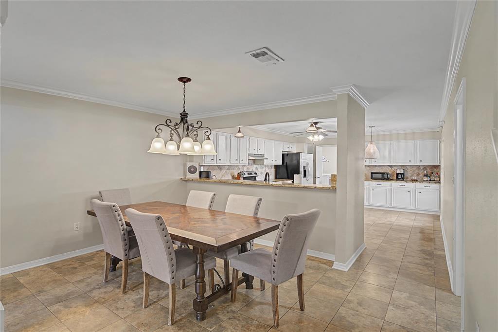 10056 Alondra Street Shreveport, LA 71115 - Photo 7 of 31 a view of a dining room with furniture and wooden floor