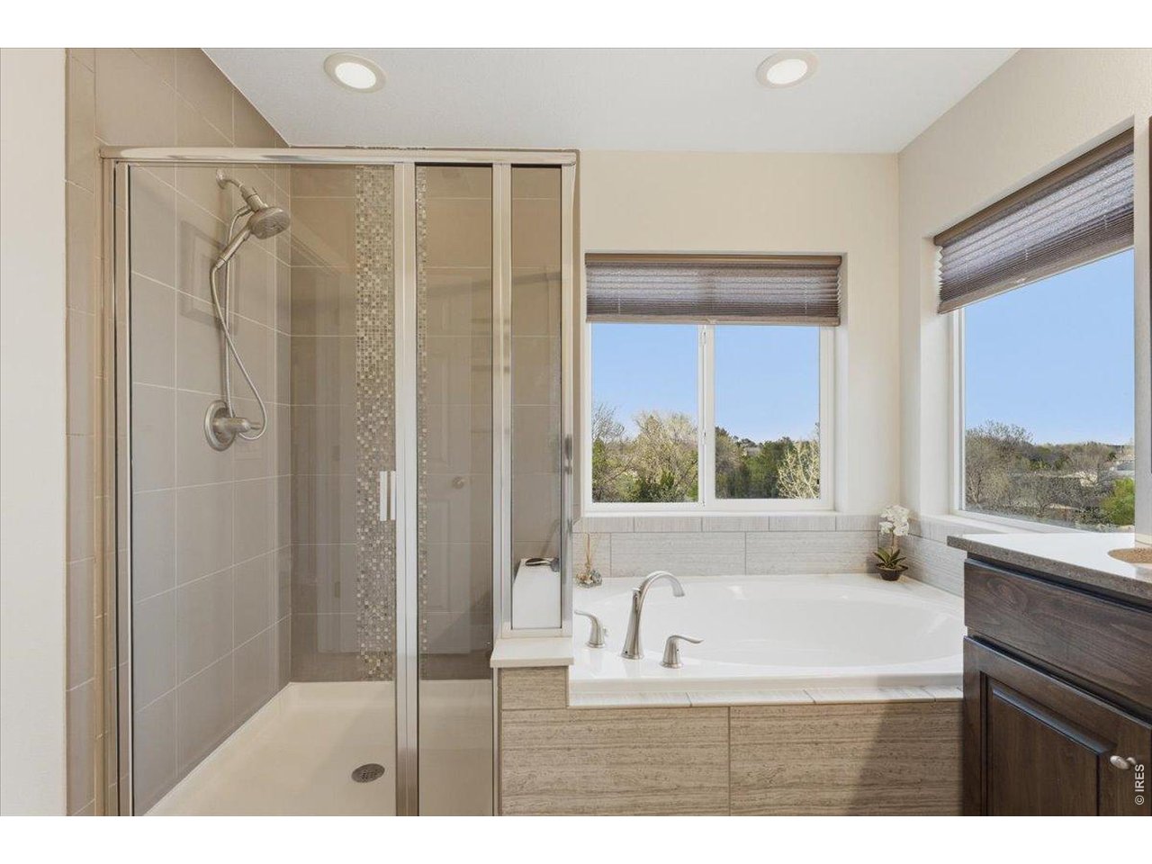 1148 Wagon Bend Road Berthoud, CO 80513 - Photo 32 of 50 a bathroom with a bathtub and a shower