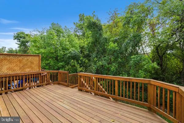 a view of deck with wooden floor and fence