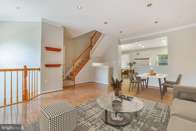 a living room with furniture and a dining table