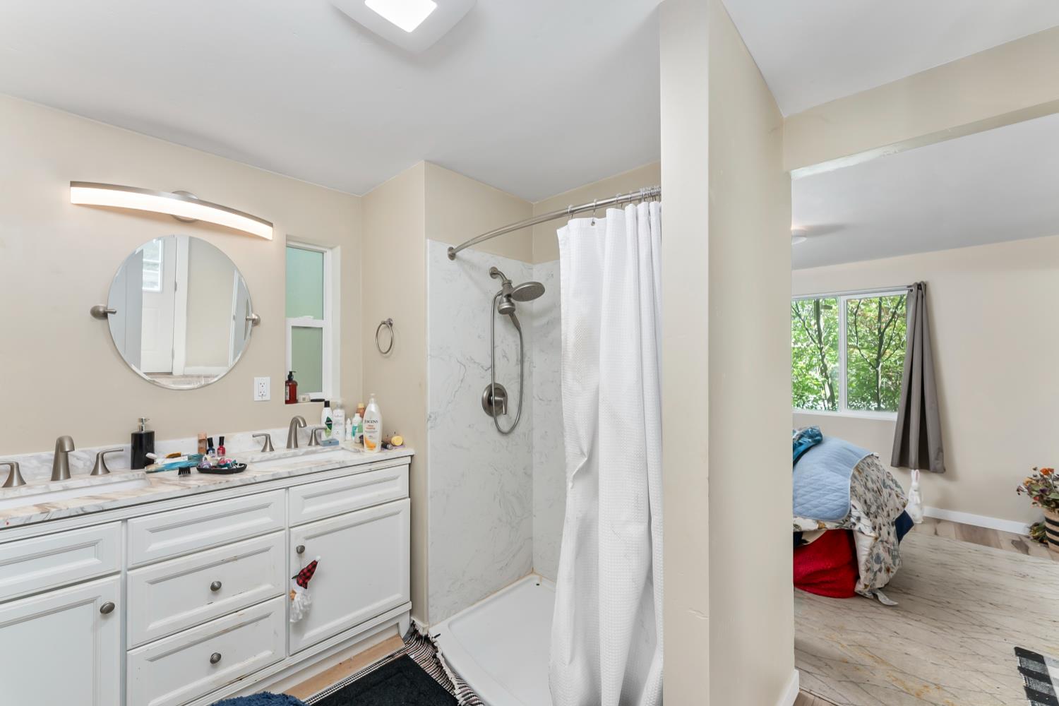 1525 Cold Springs Road, Unit 97 Placerville, CA 95667 - Photo 28 of 48 a en suite bathroom with a double vanity sink a mirror and a shower