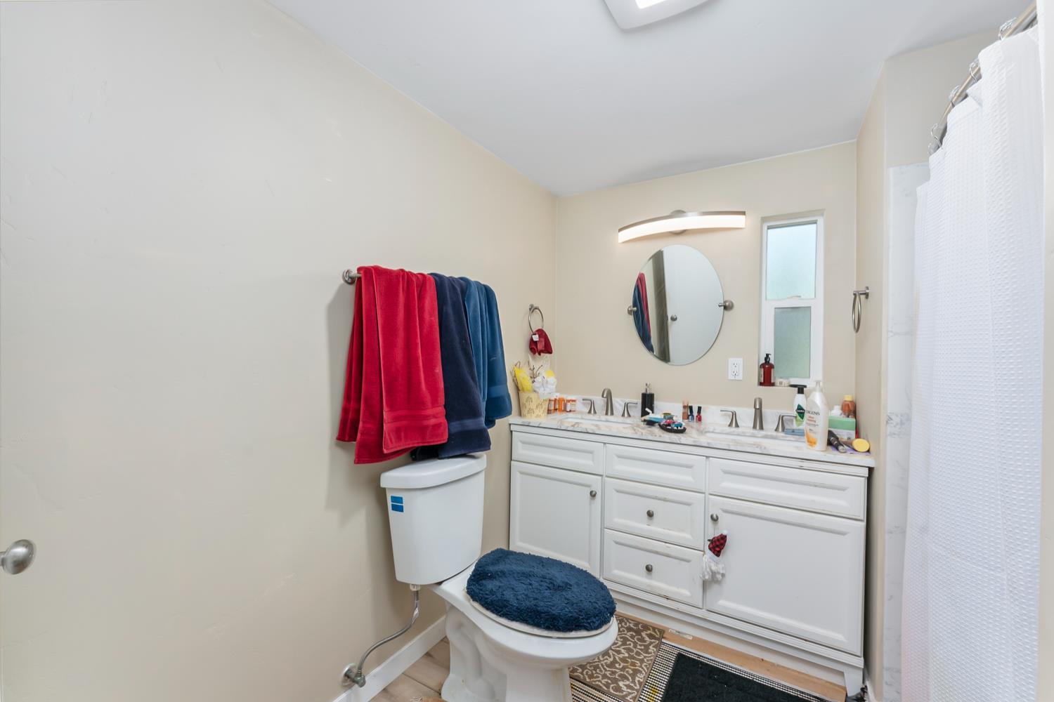 1525 Cold Springs Road, Unit 97 Placerville, CA 95667 - Photo 30 of 48 a bathroom with a toilet a sink and a mirror