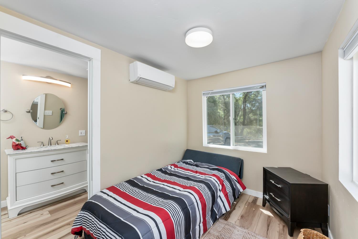 1525 Cold Springs Road, Unit 97 Placerville, CA 95667 - Photo 34 of 48 a bedroom with a bed and a dresser