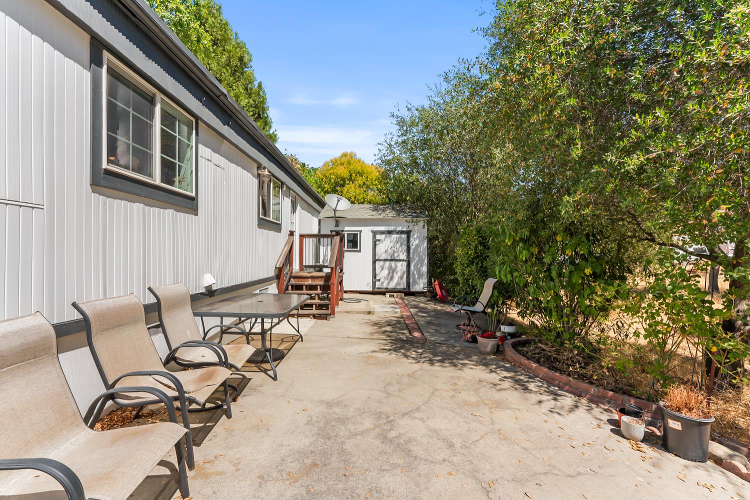 1525 Cold Springs Road, Unit 97 Placerville, CA 95667 - Photo 37 of 48 a view of a house with backyard and sitting area