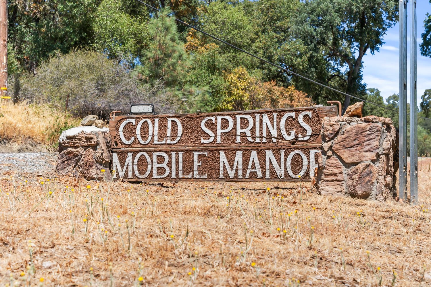 1525 Cold Springs Road, Unit 97 Placerville, CA 95667 - Photo 39 of 48 a street sign that is on a brick wall