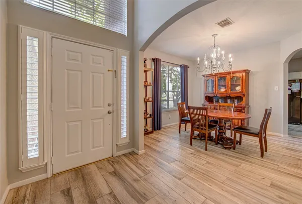 a kitchen with granite countertop white cabinets sink and stainless steel appliances