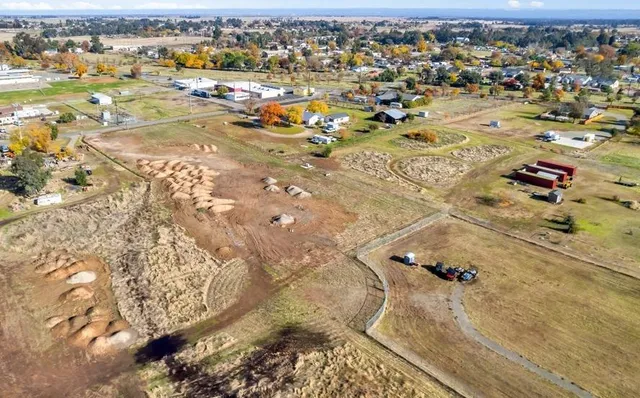 an aerial view of residential houses with outdoor space