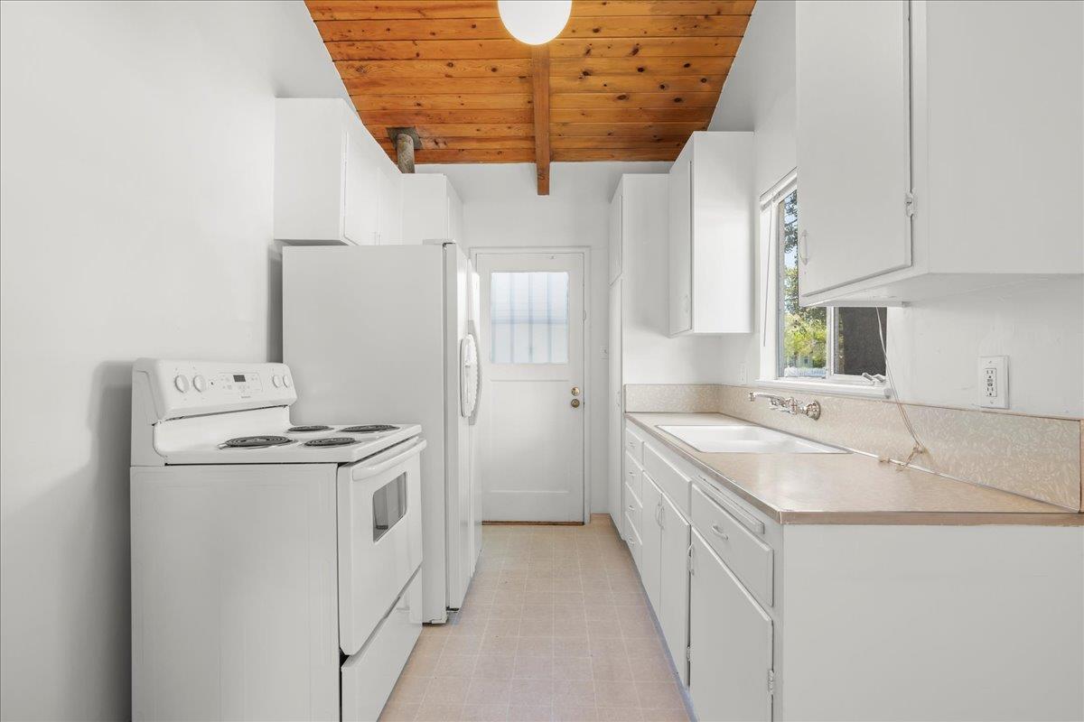 1556 Fourth Street Livermore, CA 94550 - Photo 8 of 18 a bathroom with a sink and a mirror