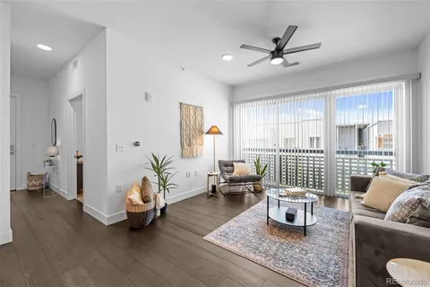 a living room with furniture and view of window