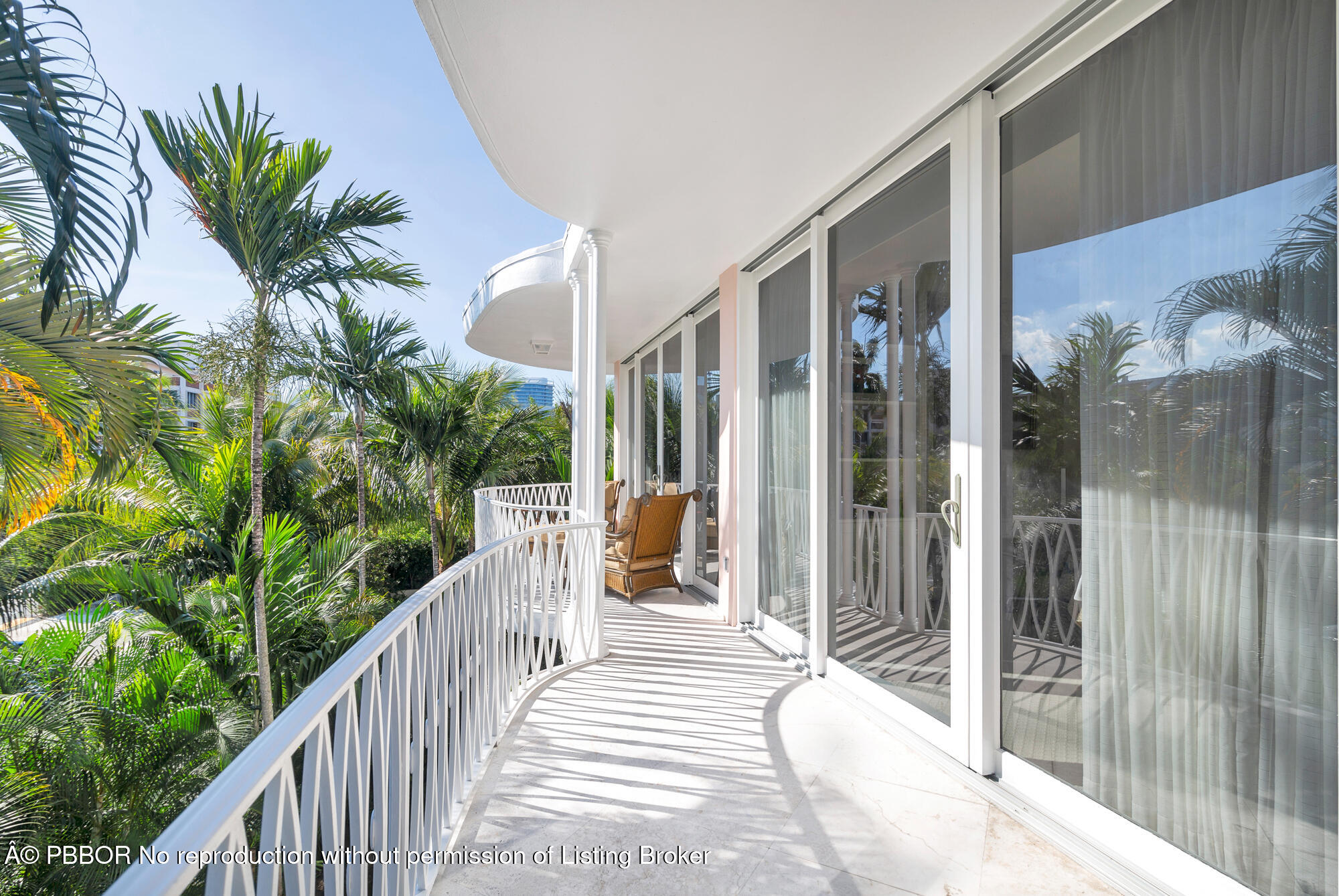 429 Australian Avenue, Unit 110 Palm Beach, FL 33480 - Photo 14 of 18 a view of a house with balcony and wooden floor