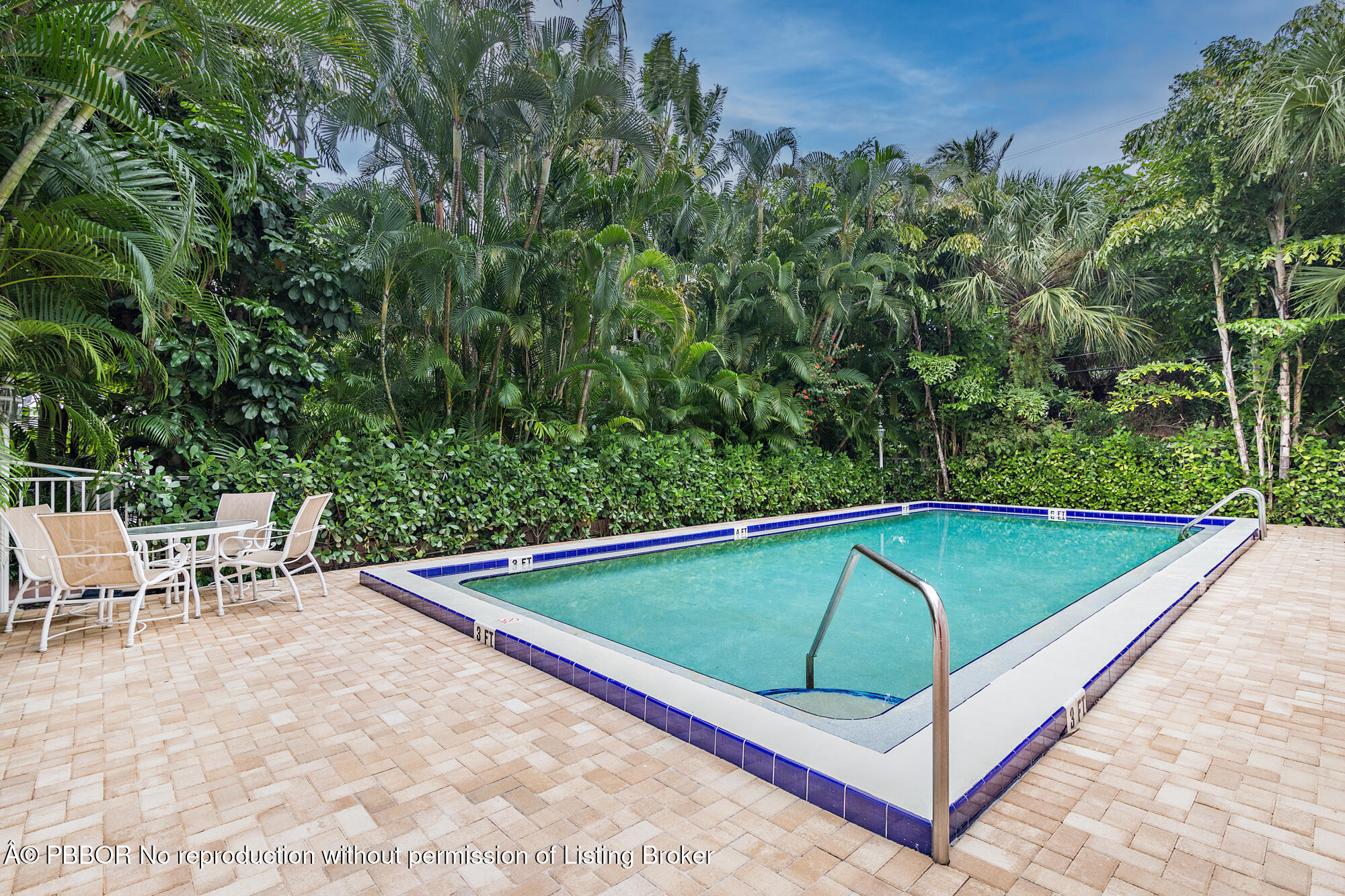 429 Australian Avenue, Unit 110 Palm Beach, FL 33480 - Photo 15 of 18 a view of a backyard with a small swimming pool and sitting area