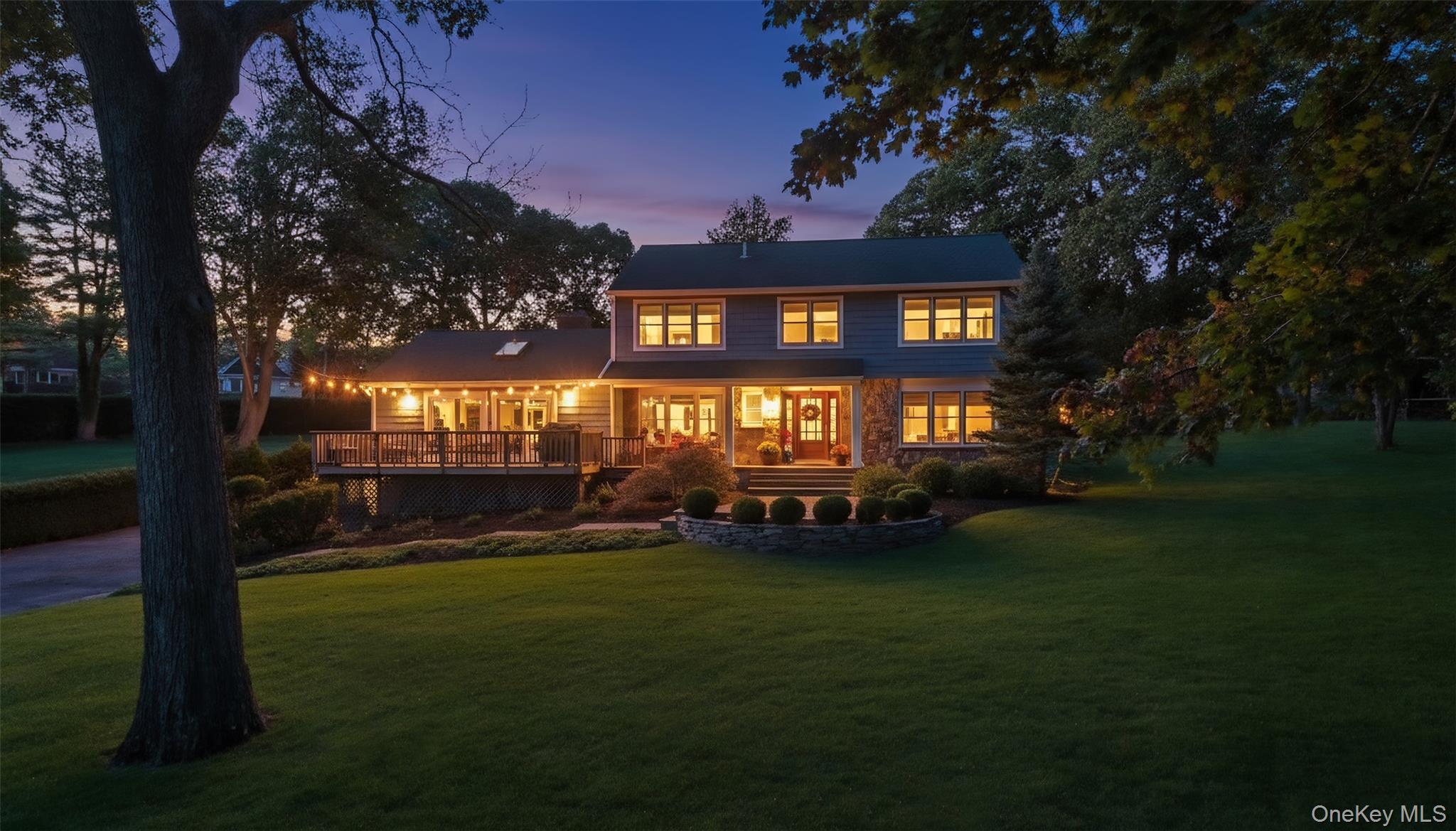 39 Bevin Road Northport, NY 11768 - Photo 2 of 44 Back of house featuring a lawn and a wooden deck