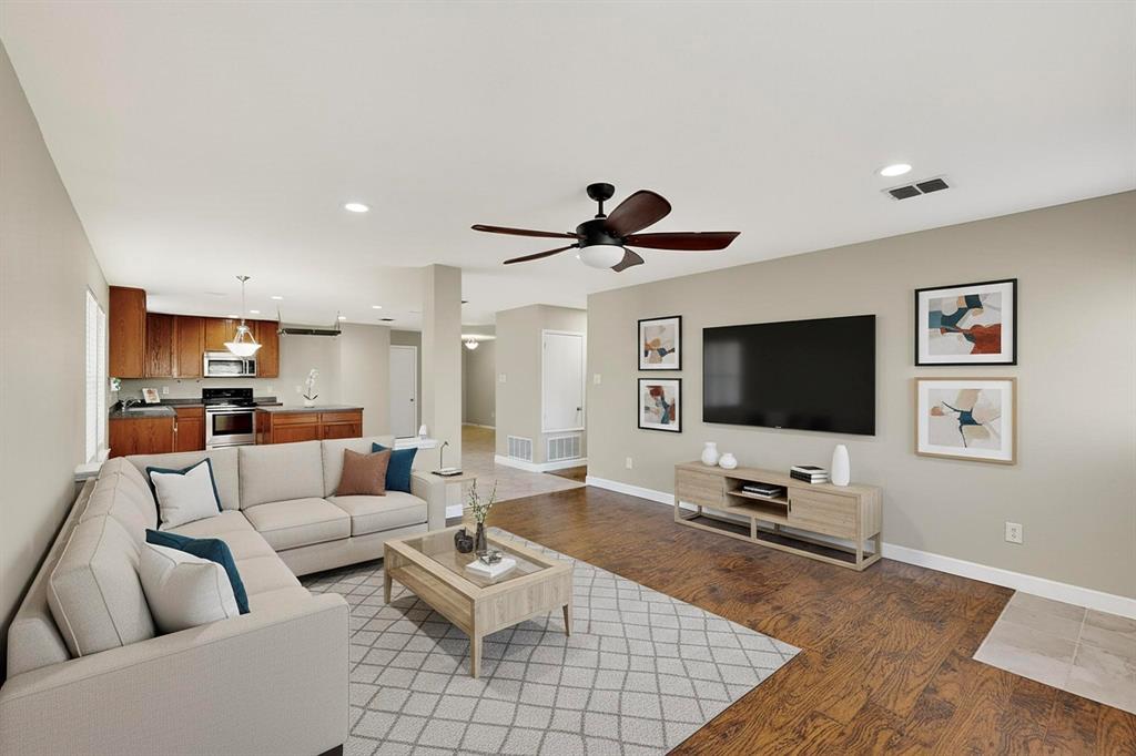 2114 Cypress Way Anna, TX 75409 - Photo 13 of 40 a living room with furniture and a flat screen tv