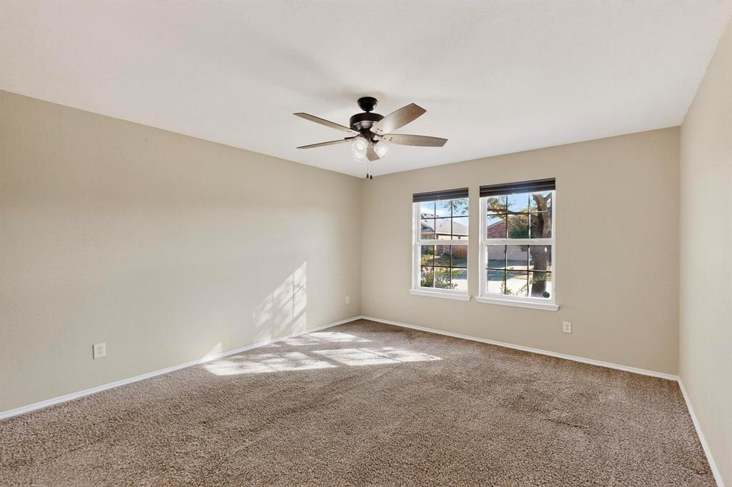 2114 Cypress Way Anna, TX 75409 - Photo 16 of 40 a view of a room with windows and chandelier fan