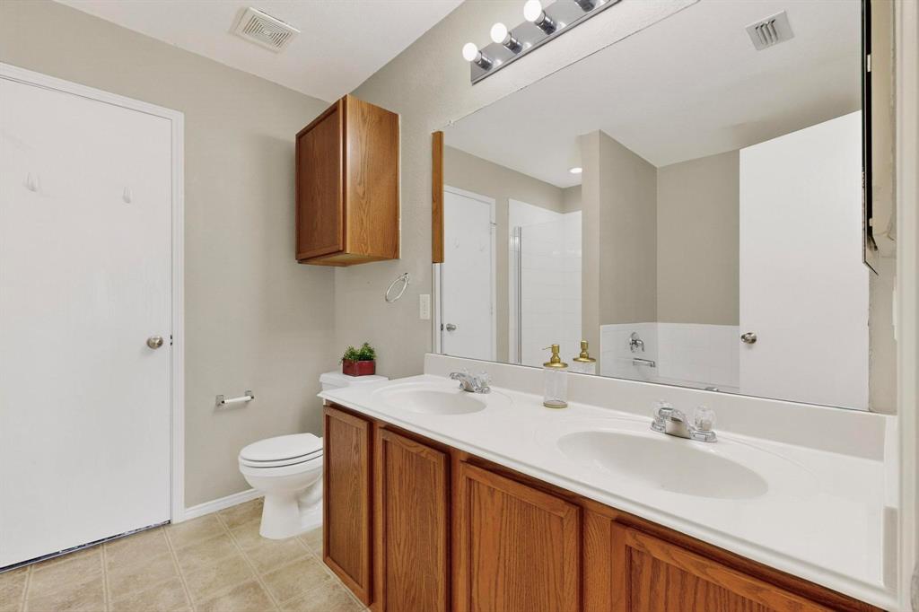 2114 Cypress Way Anna, TX 75409 - Photo 19 of 40 a bathroom with a sink and a mirror