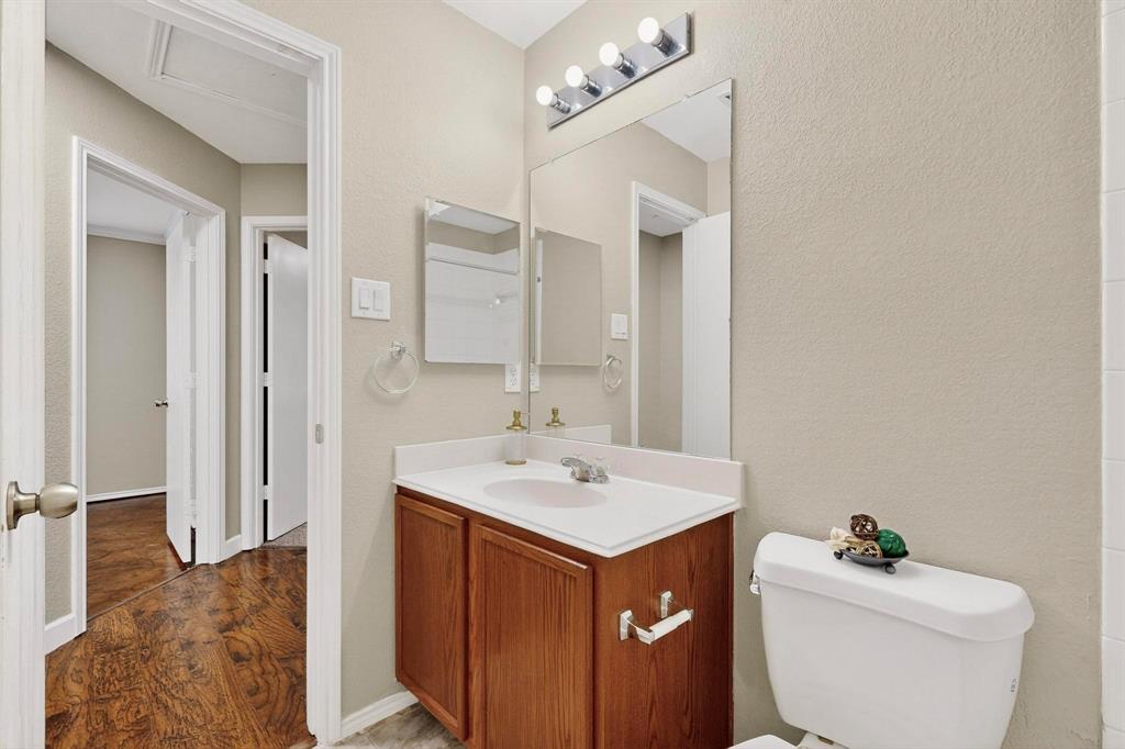 2114 Cypress Way Anna, TX 75409 - Photo 26 of 40 a bathroom with a sink toilet and shower