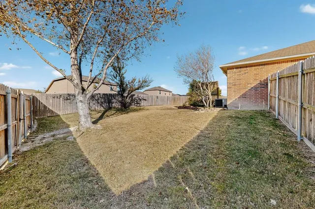 a view of a house with a snow in the yard