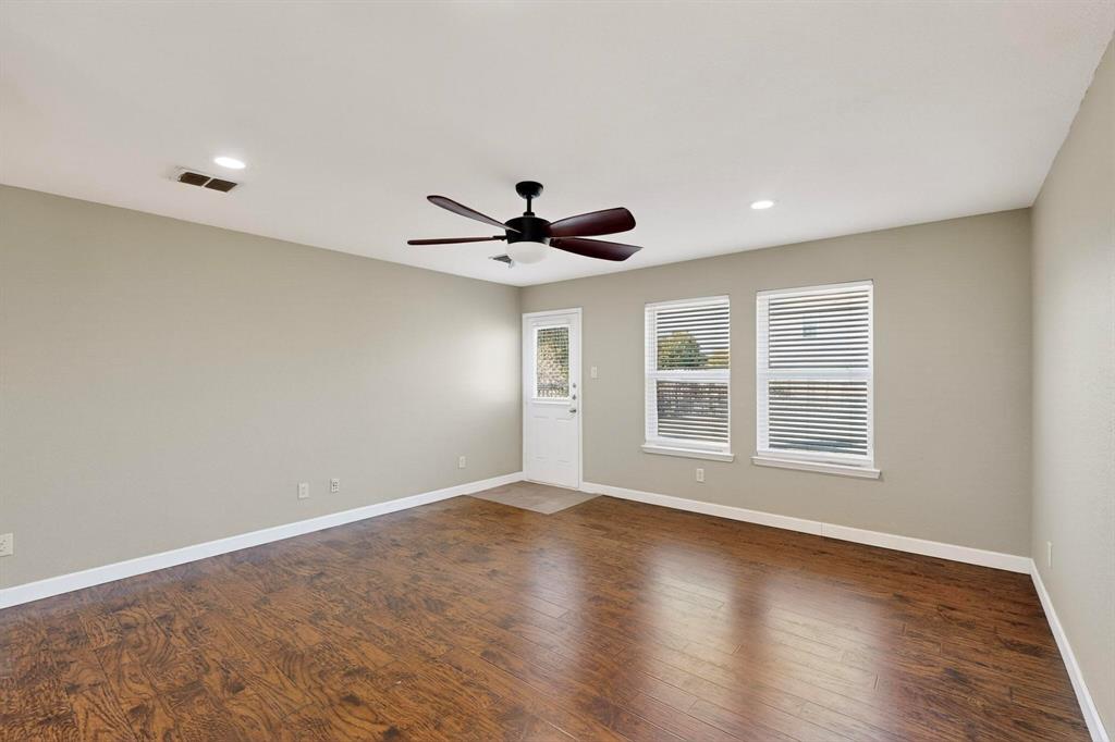 2114 Cypress Way Anna, TX 75409 - Photo 6 of 40 a view of empty room with wooden floor and fan
