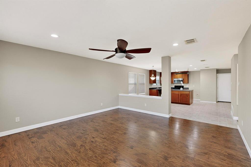 2114 Cypress Way Anna, TX 75409 - Photo 8 of 40 a view of empty room with wooden floor