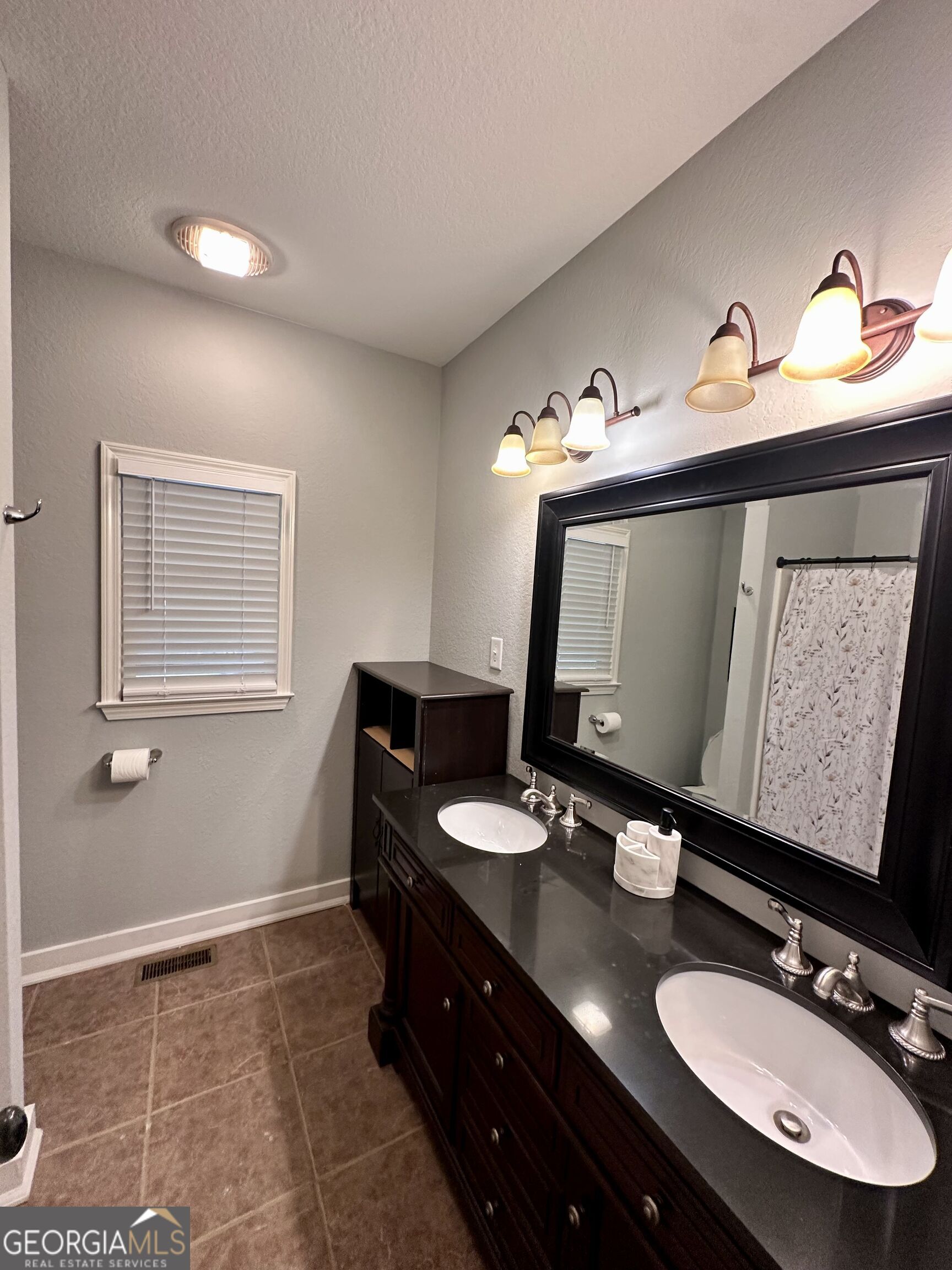 2769 Bean Creek Road Sautee Nacoochee, GA 30571 - Photo 14 of 33 a bathroom with a double vanity sink and a mirror