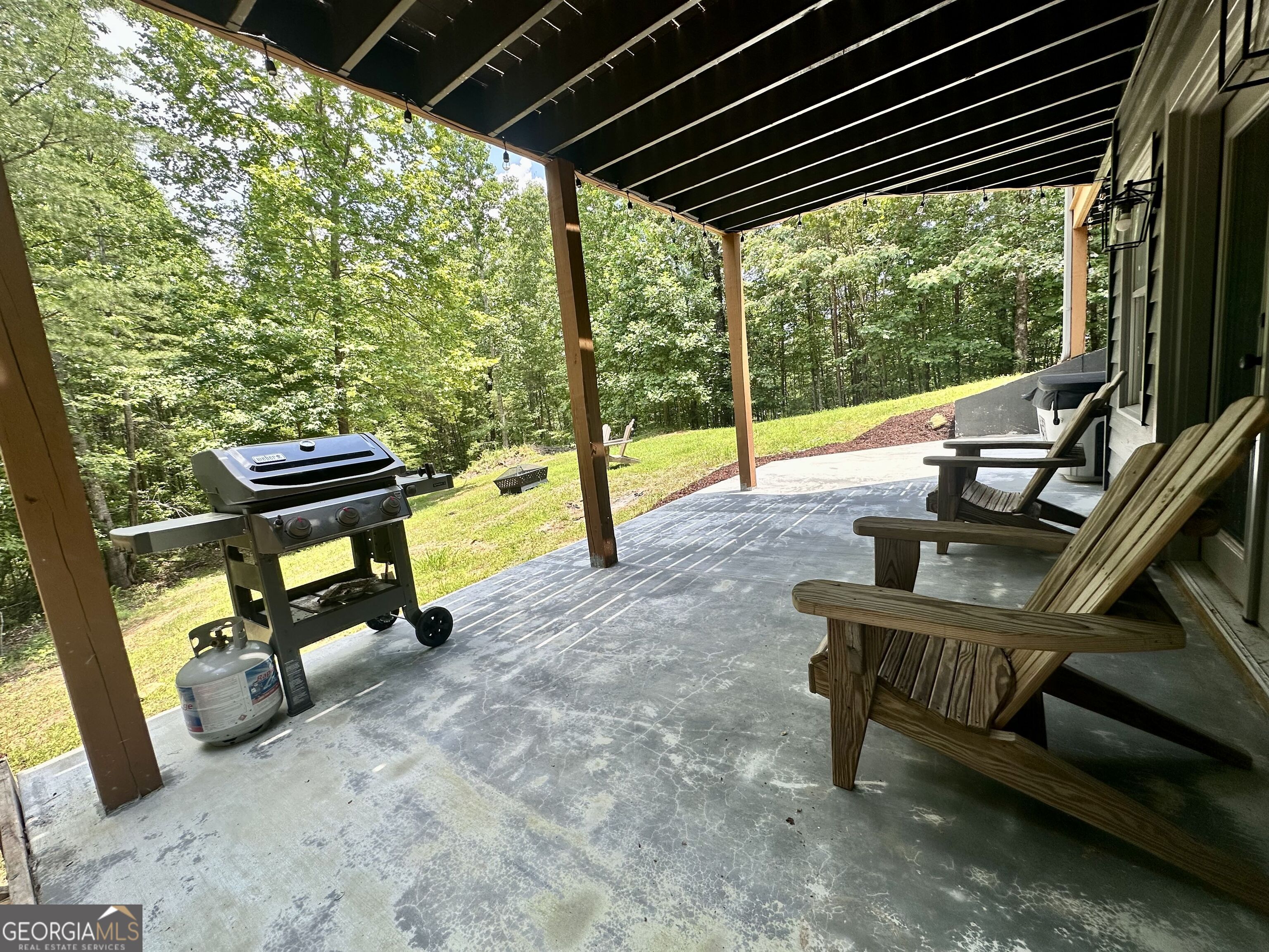 2769 Bean Creek Road Sautee Nacoochee, GA 30571 - Photo 24 of 33 a view of a chairs and table in the patio