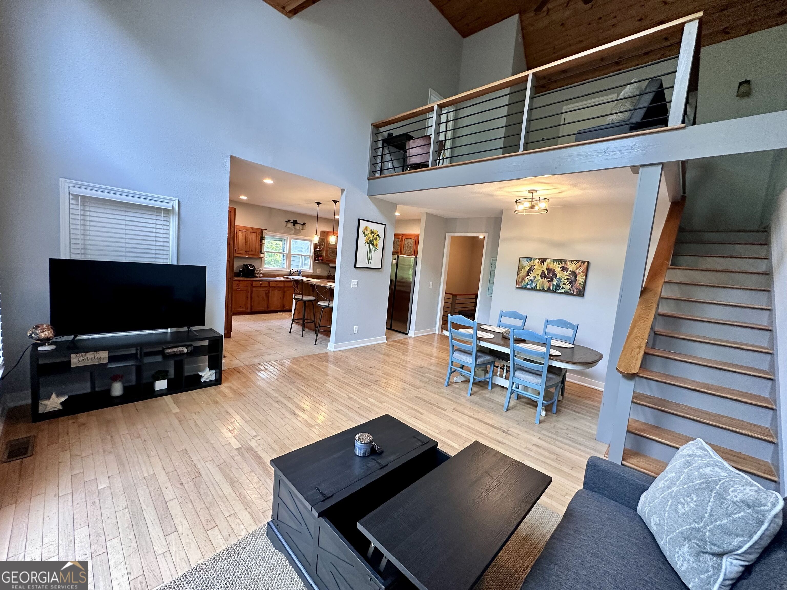 2769 Bean Creek Road Sautee Nacoochee, GA 30571 - Photo 6 of 33 a living room with furniture and a flat screen tv