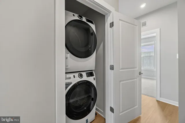 a bedroom with a large bed and a large window