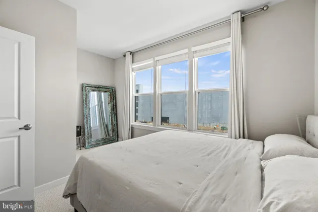 a bedroom with a bed and a table