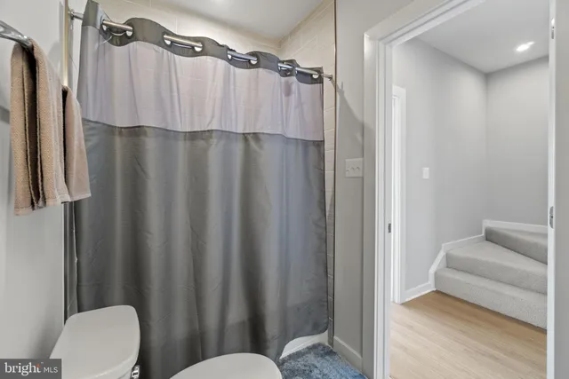 a view of kitchen with microwave and refrigerator