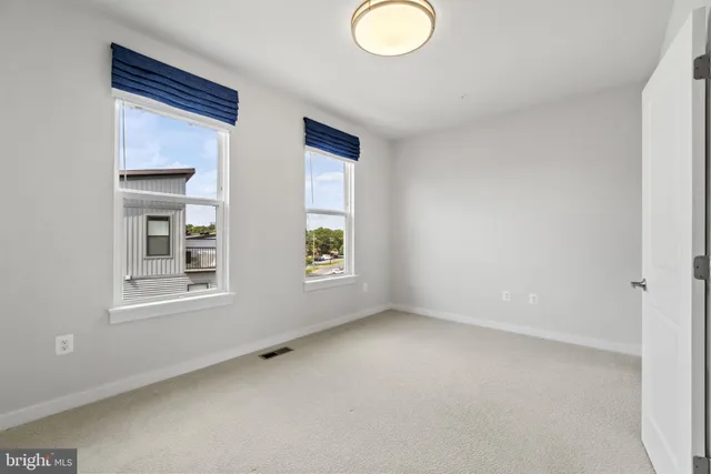 a bathroom with a shower a toilet and sink