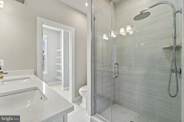 a view of a room with rack on the wall and a window