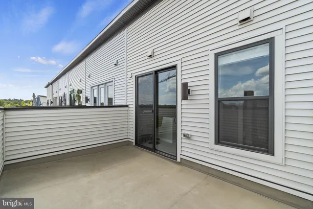 a view of a chair and table on the deck