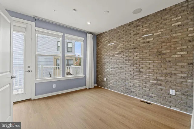 a view of kitchen with stainless steel appliances refrigerator oven and stove