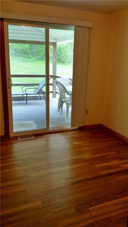 196 Old Maids Road Ruffs Dale, PA 15679 - Photo 20 of 25 Third bedroom with sliding door access to the deck