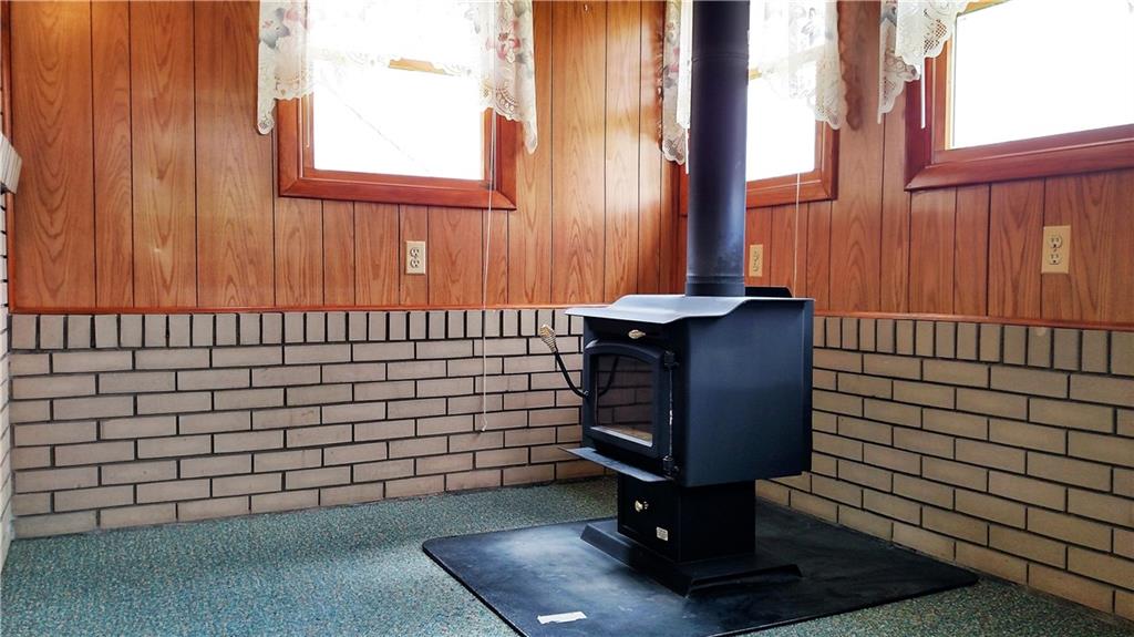 196 Old Maids Road Ruffs Dale, PA 15679 - Photo 22 of 25 Four Season Room with wood burner