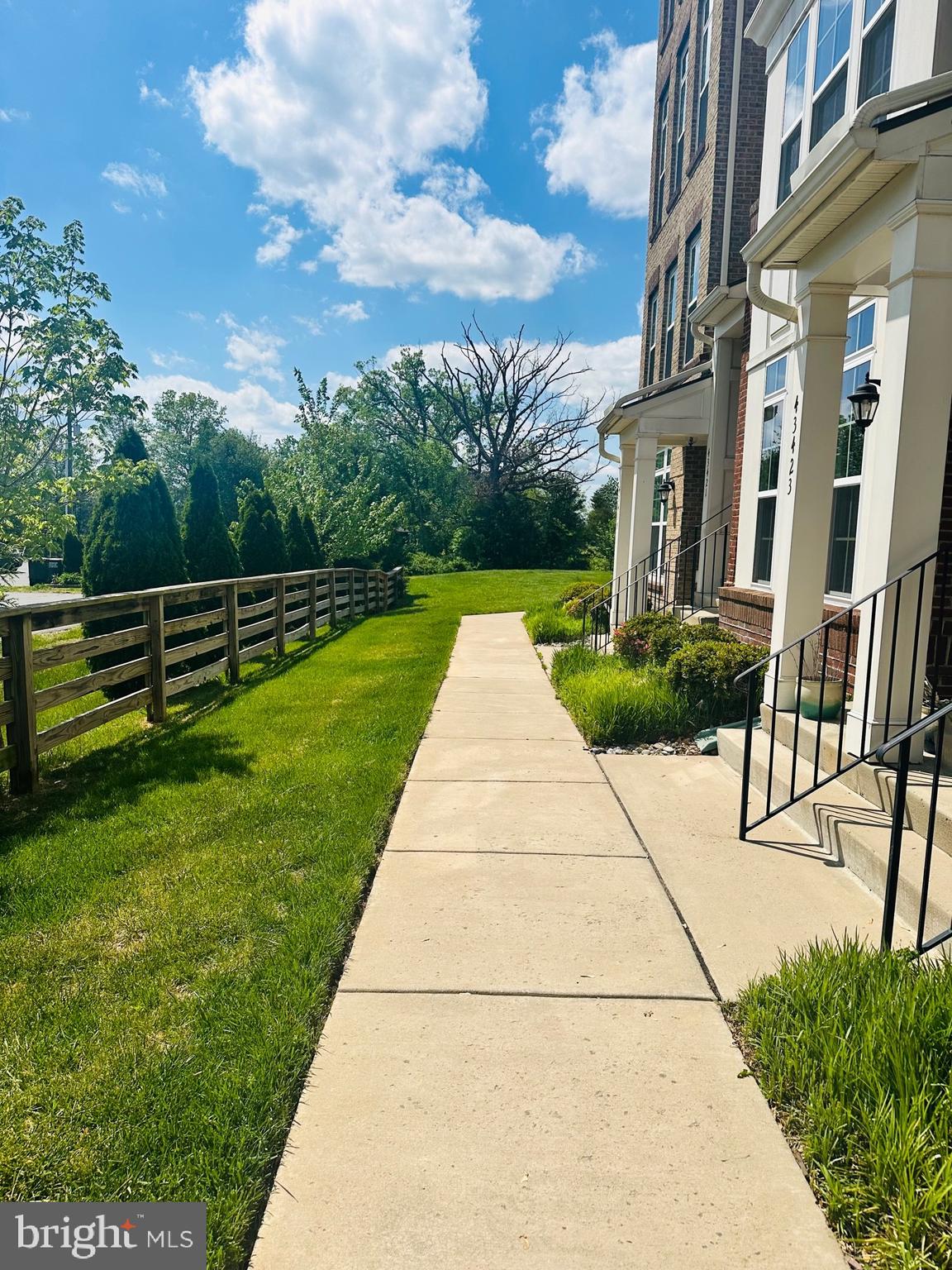 43427 Town Gate Square Chantilly, VA 20152 - Photo 2 of 11 a view of a pathway with a yard