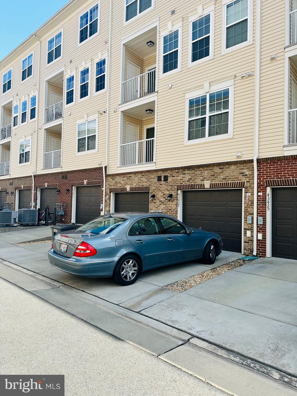 43427 Town Gate Square Chantilly, VA 20152 - Photo 3 of 11 a front view of a house with parking space