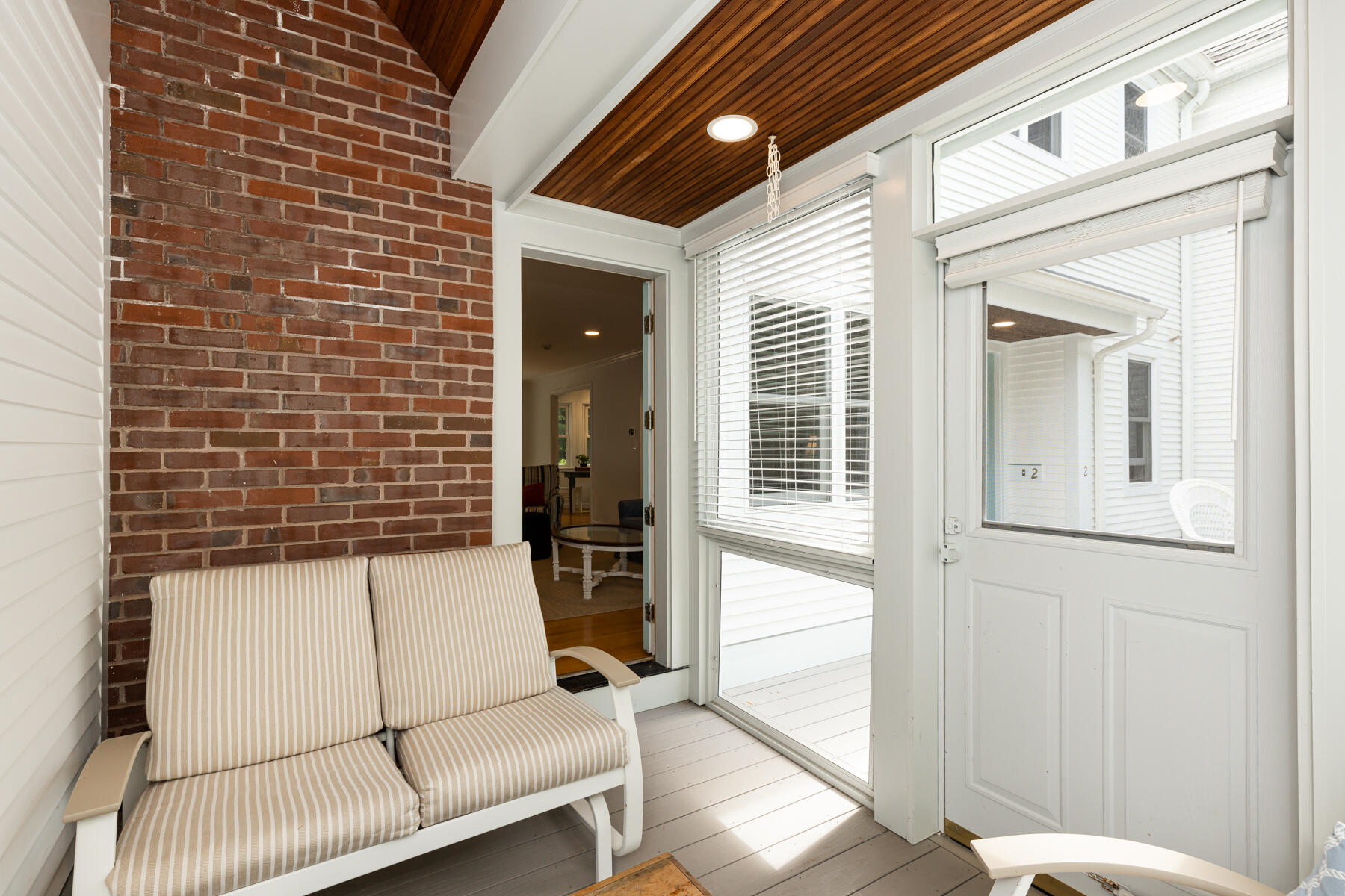 2 Bob White Crescent Mashpee, MA 02649 - Photo 12 of 47 a stairs and a couch in front of a door