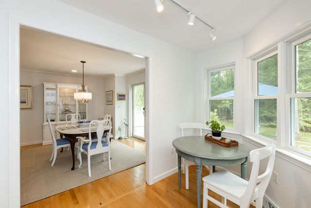 a view of a dining room with furniture and window
