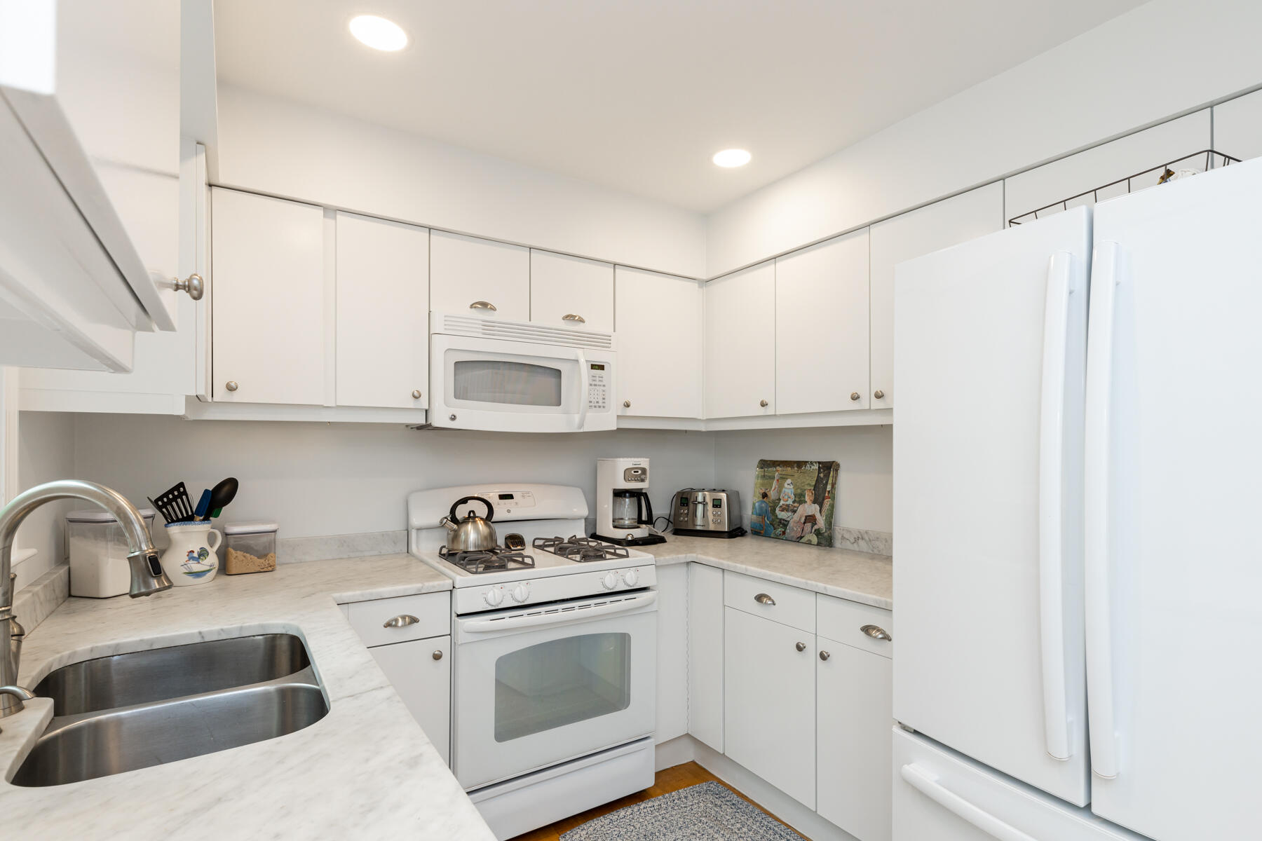 2 Bob White Crescent Mashpee, MA 02649 - Photo 21 of 47 a kitchen with stainless steel appliances granite countertop white cabinets and a sink