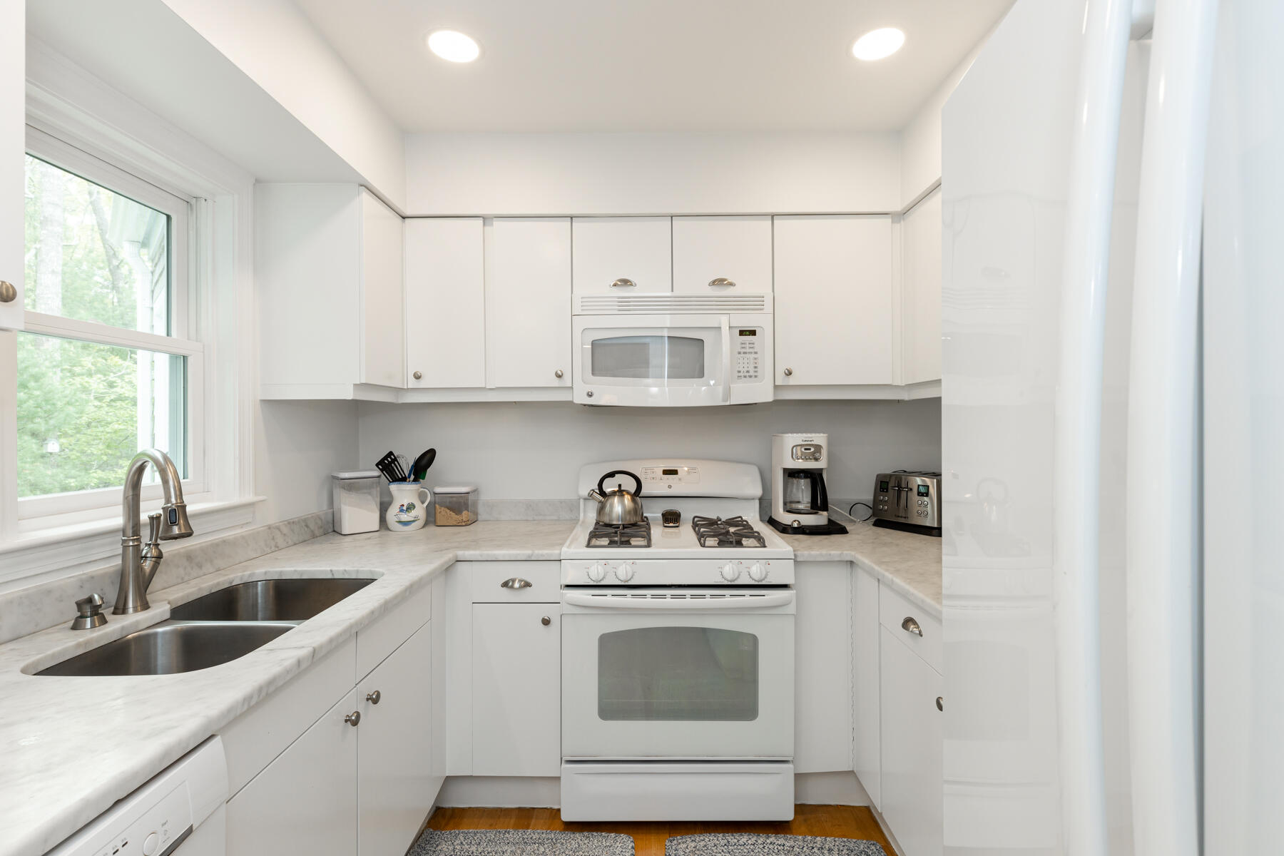 2 Bob White Crescent Mashpee, MA 02649 - Photo 22 of 47 a kitchen with stainless steel appliances granite countertop a sink a stove and cabinets